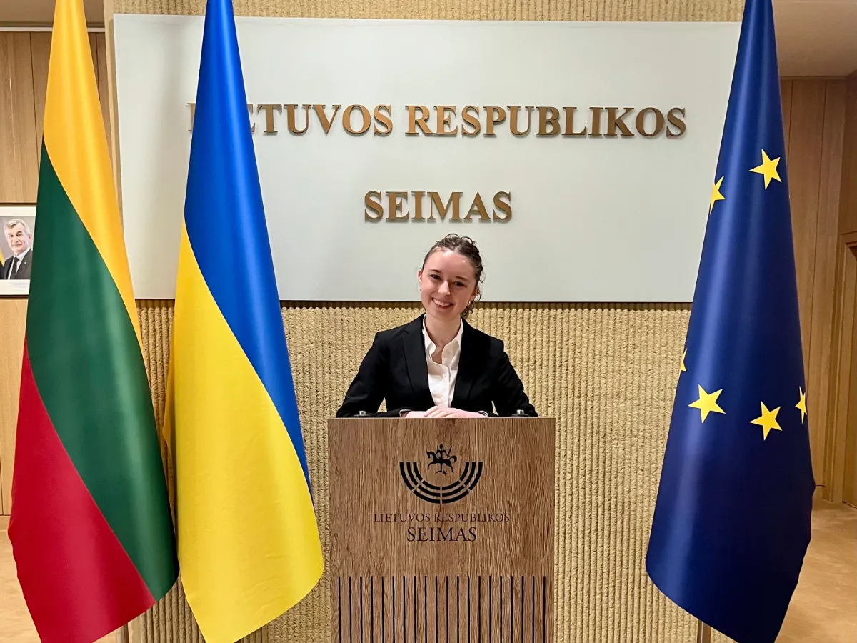 Vija Tessman in front of a podium