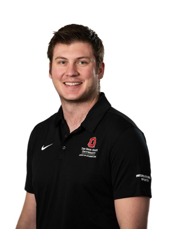 Picture of David Swearingen (Smiling person wearing a black OSU polo, against a white backdrop)
