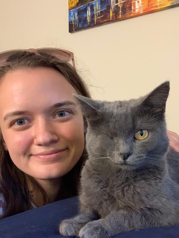 Leah with her cat (short with gray hair and missing one eye)